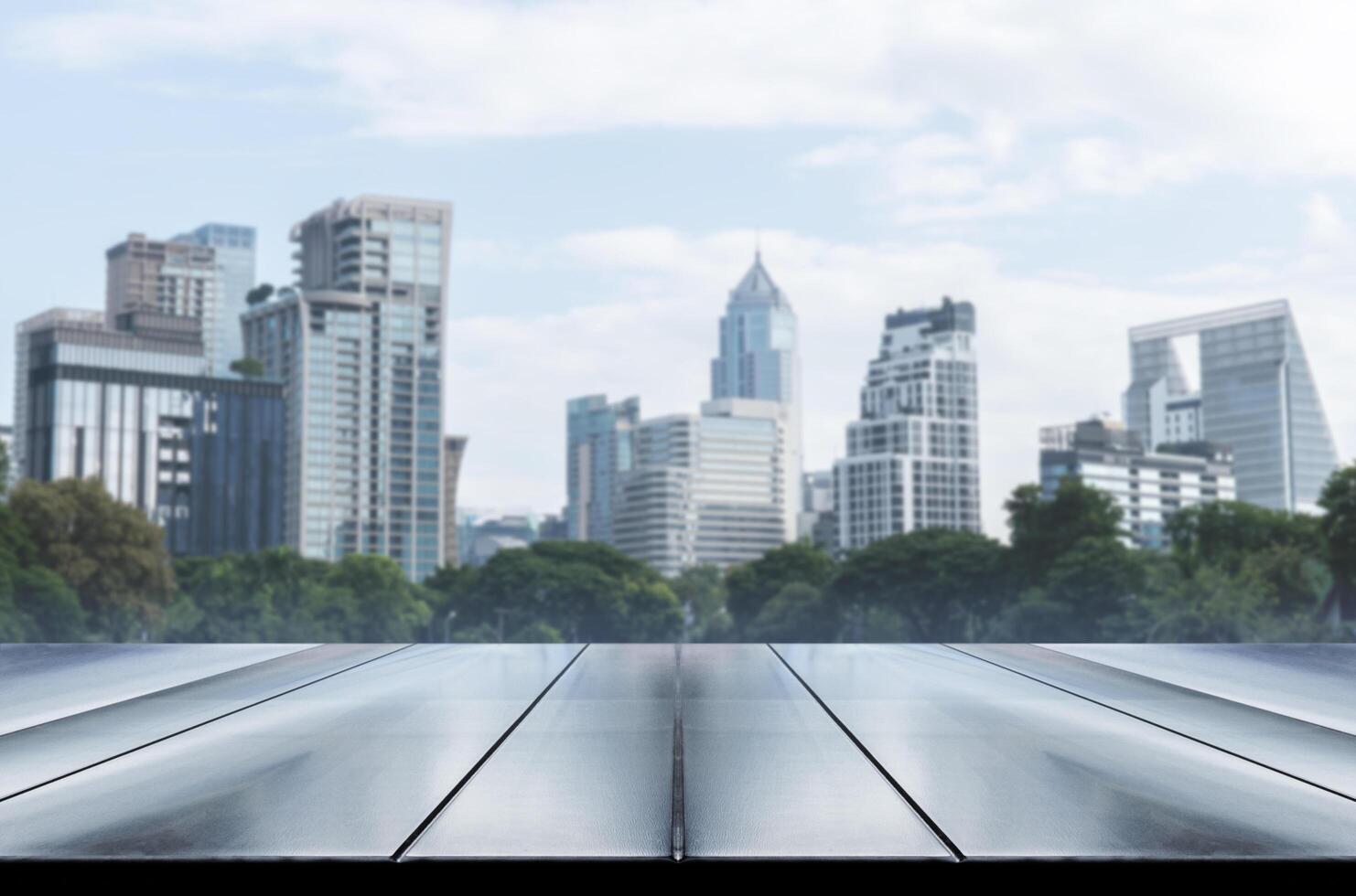 Template empty top black wooden table with cityscape view background photo