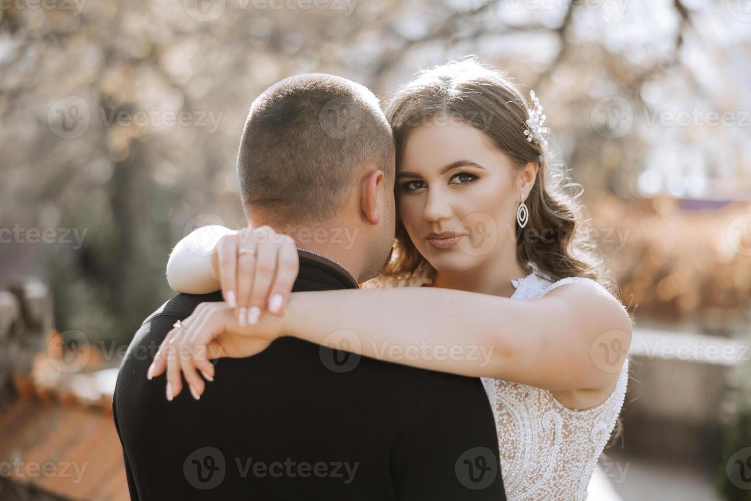 A man and a woman are hugging each other photo