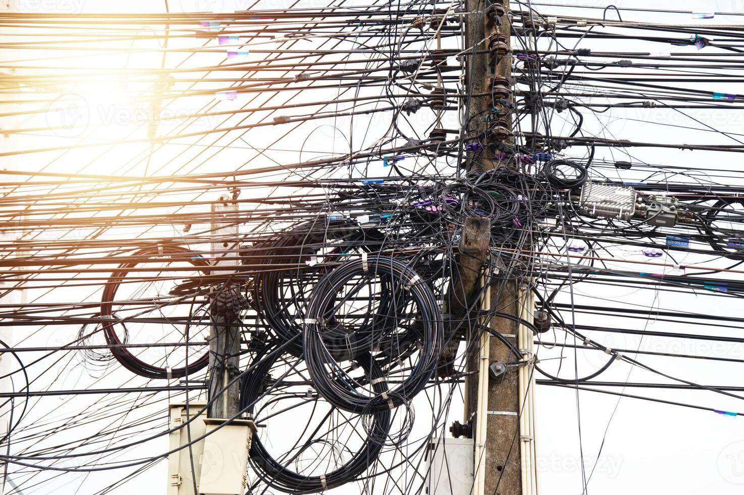 Electrical cables and signal cables installed on poles photo