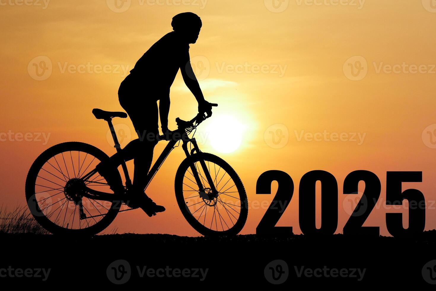 Silhouette of Cyclist Riding Bike at Sunset with 2025 in Background, Symbolizing Future Goals and Aspirations photo
