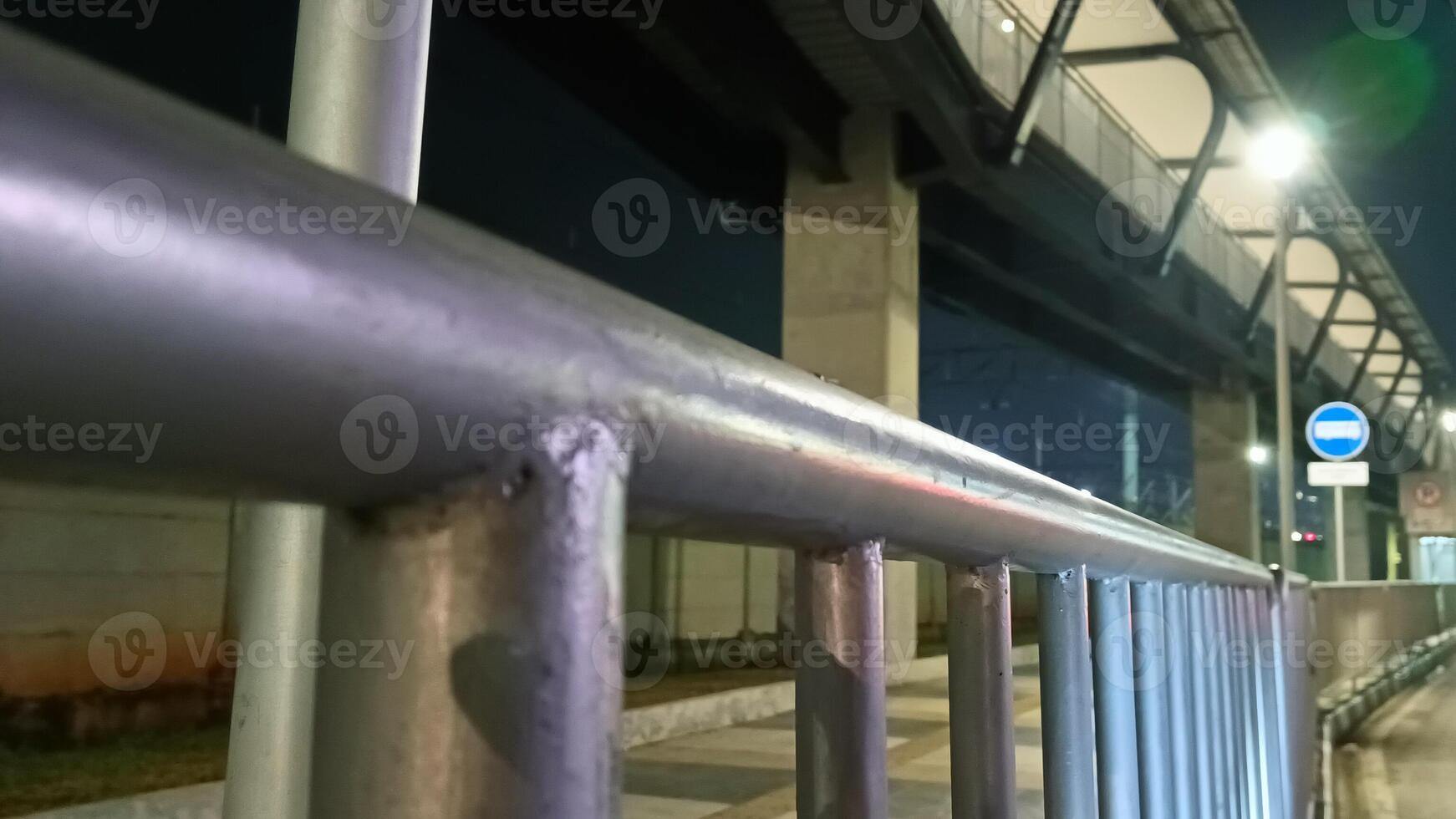 Iron handrail on the side of the road in Jakarta photo
