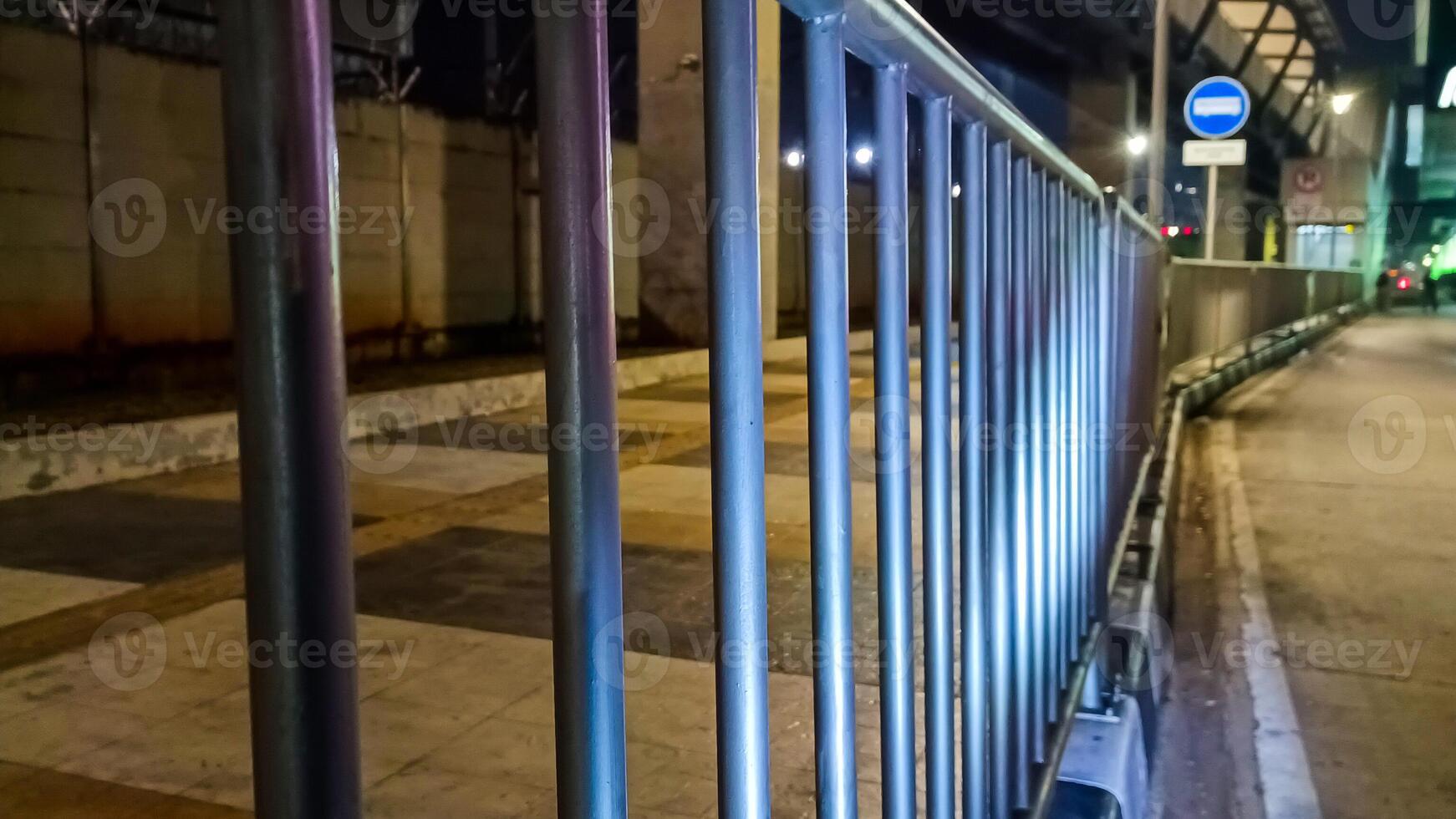 Iron handrail on the side of the road in Jakarta photo