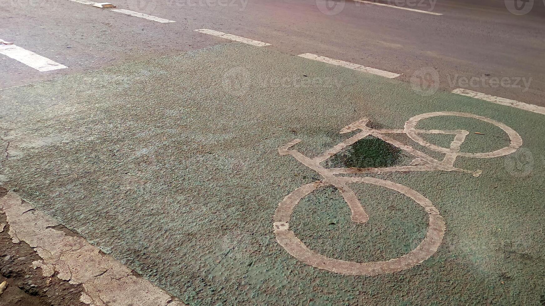 Road sign for bicycles on Jakarta city street photo