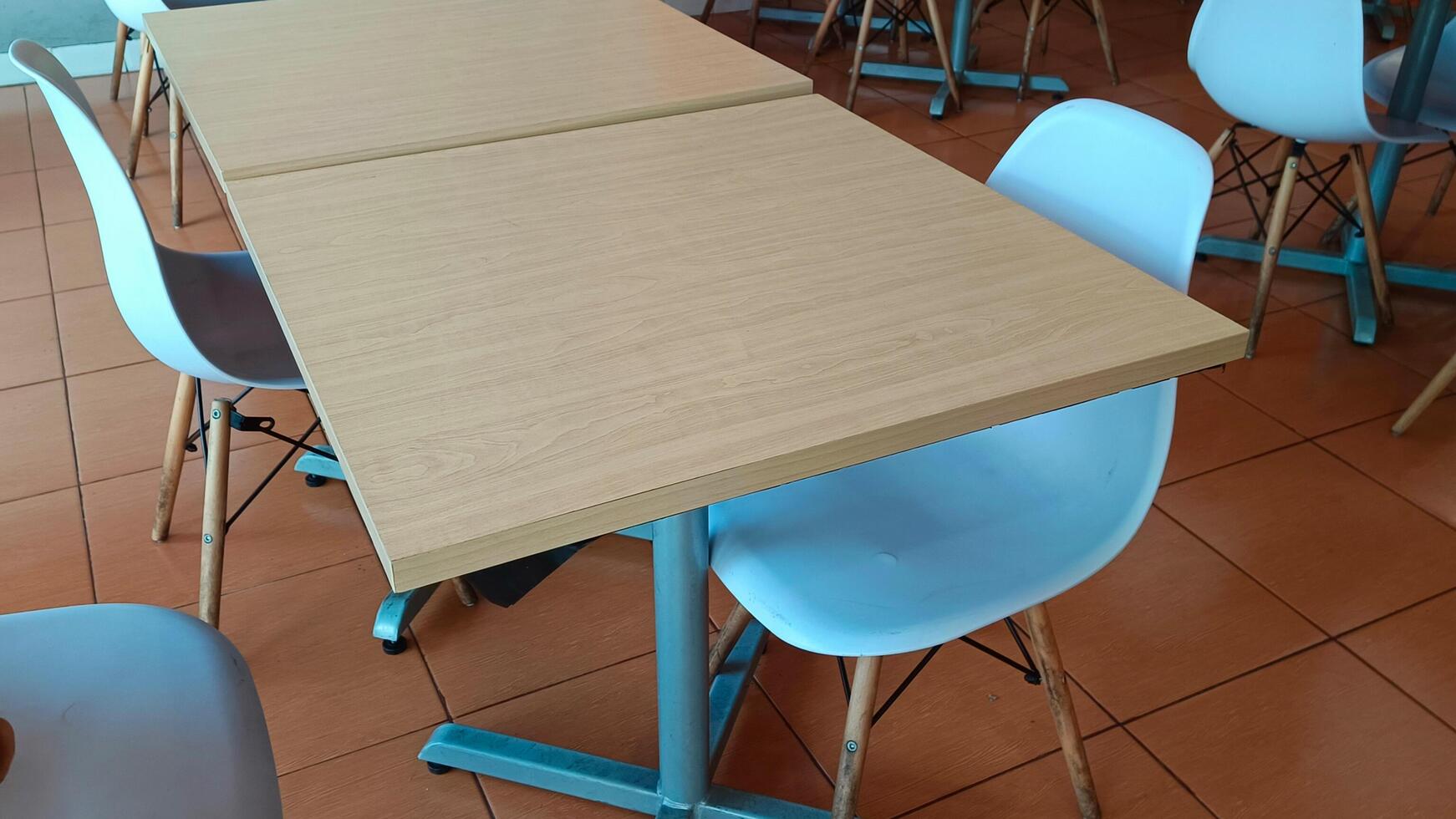 Empty tables and benches in a restaurant. photo