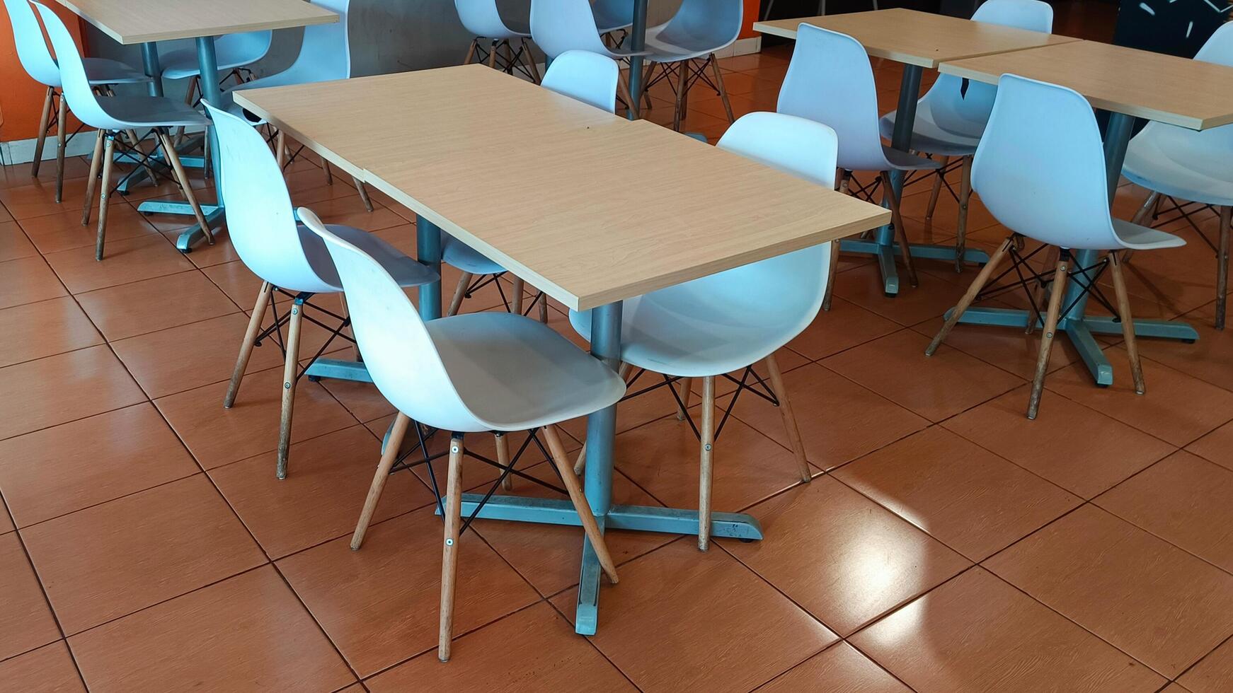 Empty tables and benches in a restaurant. photo
