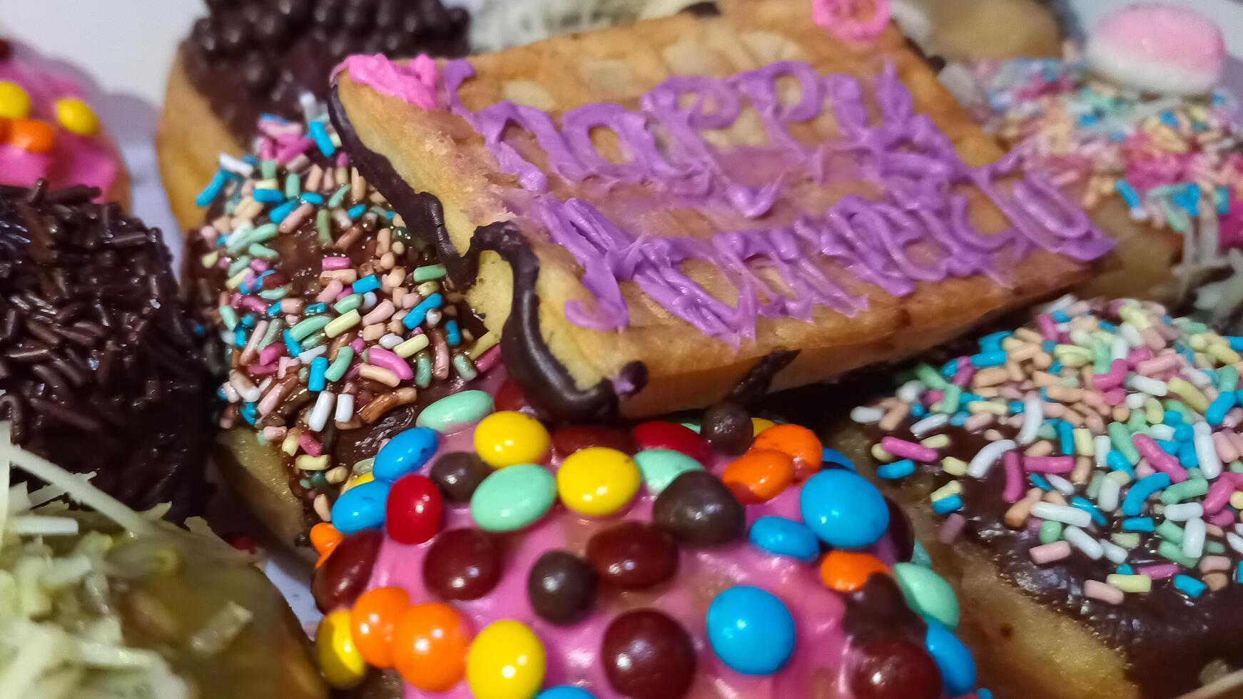 Donut cake with various toppings photo