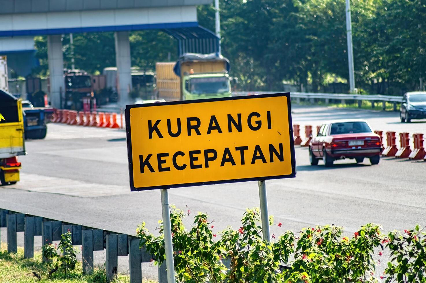 a warning sign to reduce speed on the toll road, Indonesia, 16 July 2024. photo