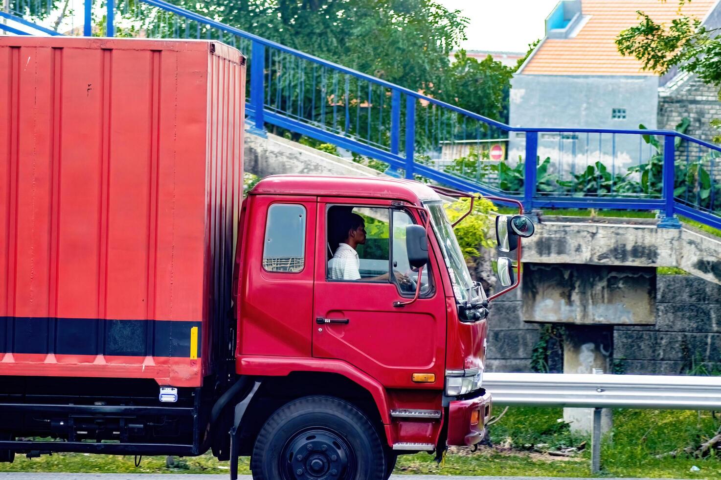 truck driver who drives a truck on the toll road or highway casually, Indonesia, 16 July 2024. photo