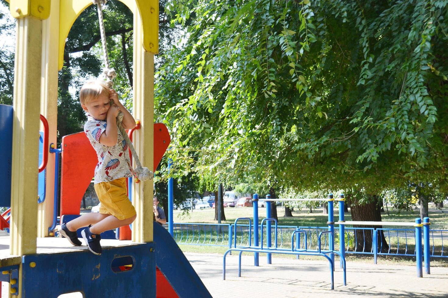 Little children run around and play in the playground. photo
