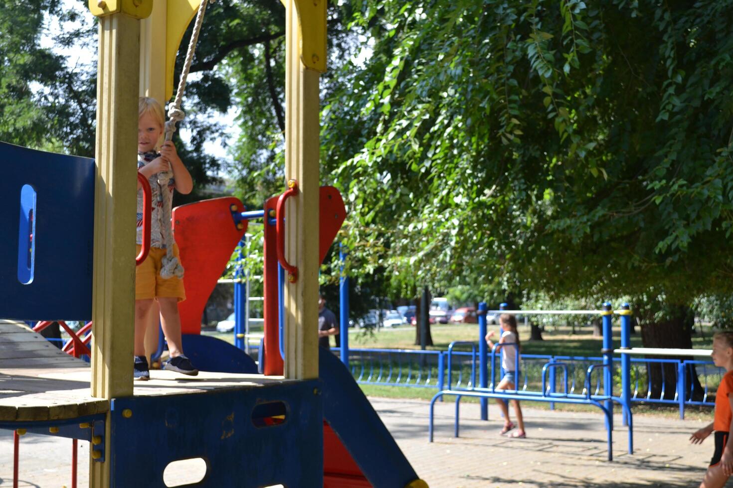 Little children run around and play in the playground. photo