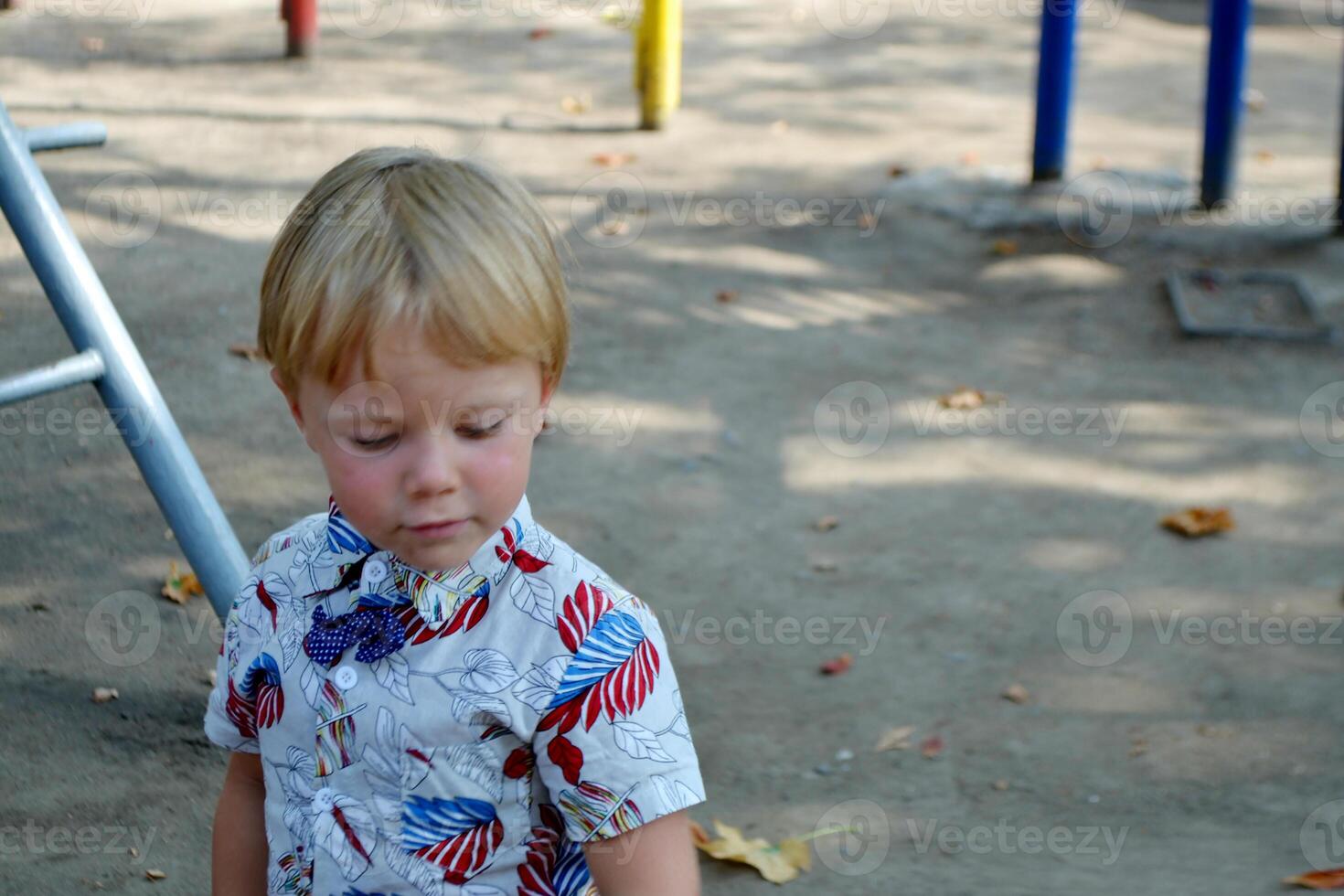 Little children run around and play in the playground. photo