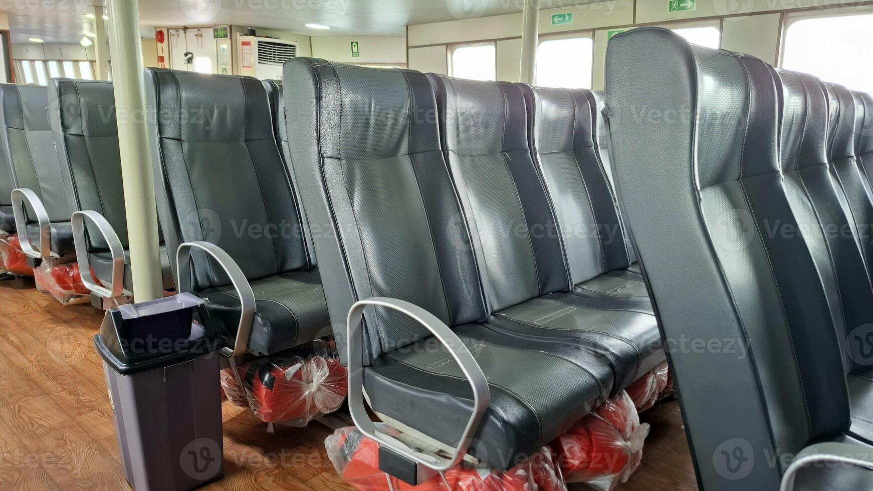 Rows of empty seats on a ferry ready for passengers photo