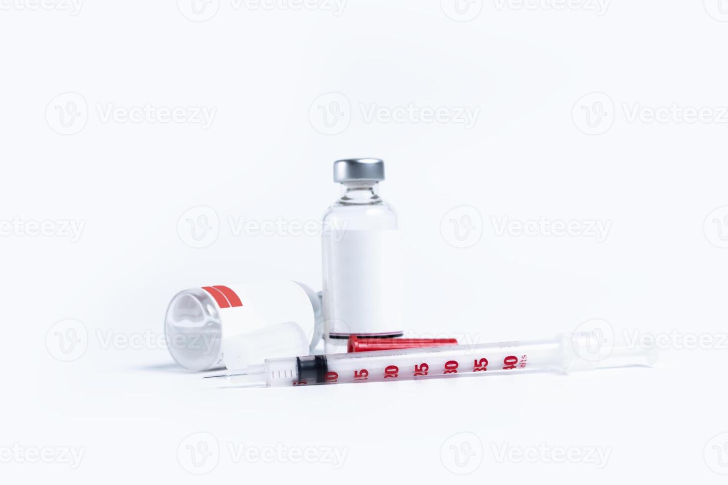 Medical vials and syringe isolated on white background. photo