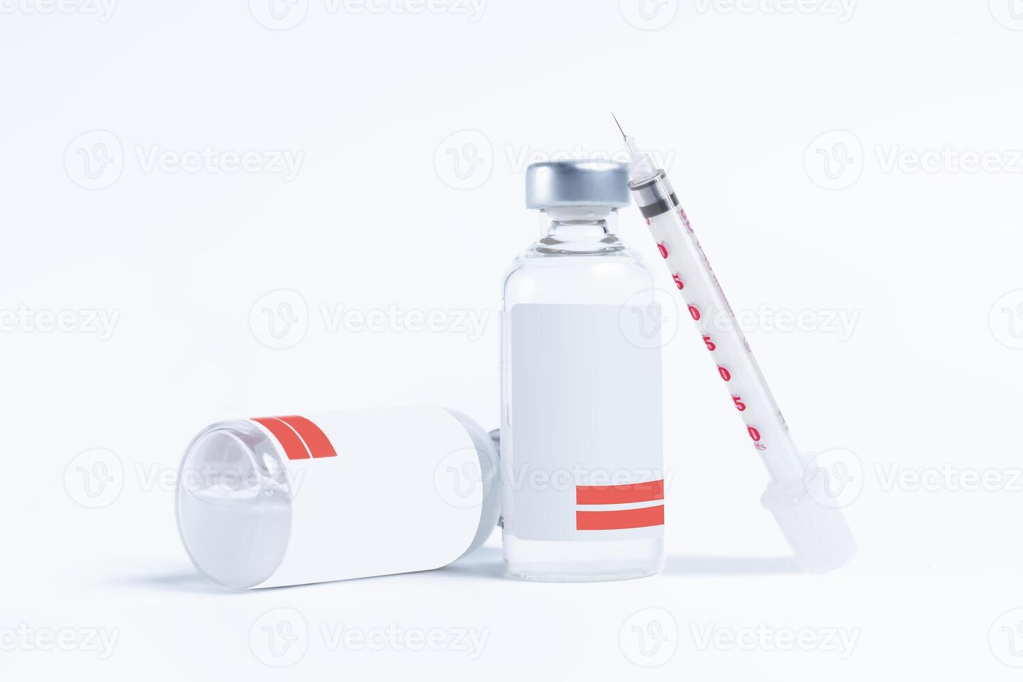Vaccine bottle and syringe on white background. photo