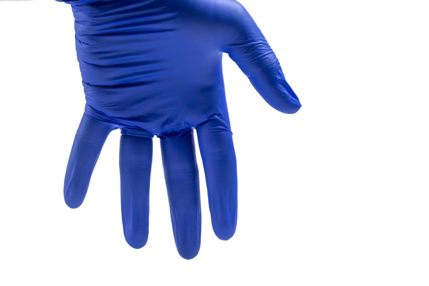 Hand in blue glove isolated on white background with clipping path. photo