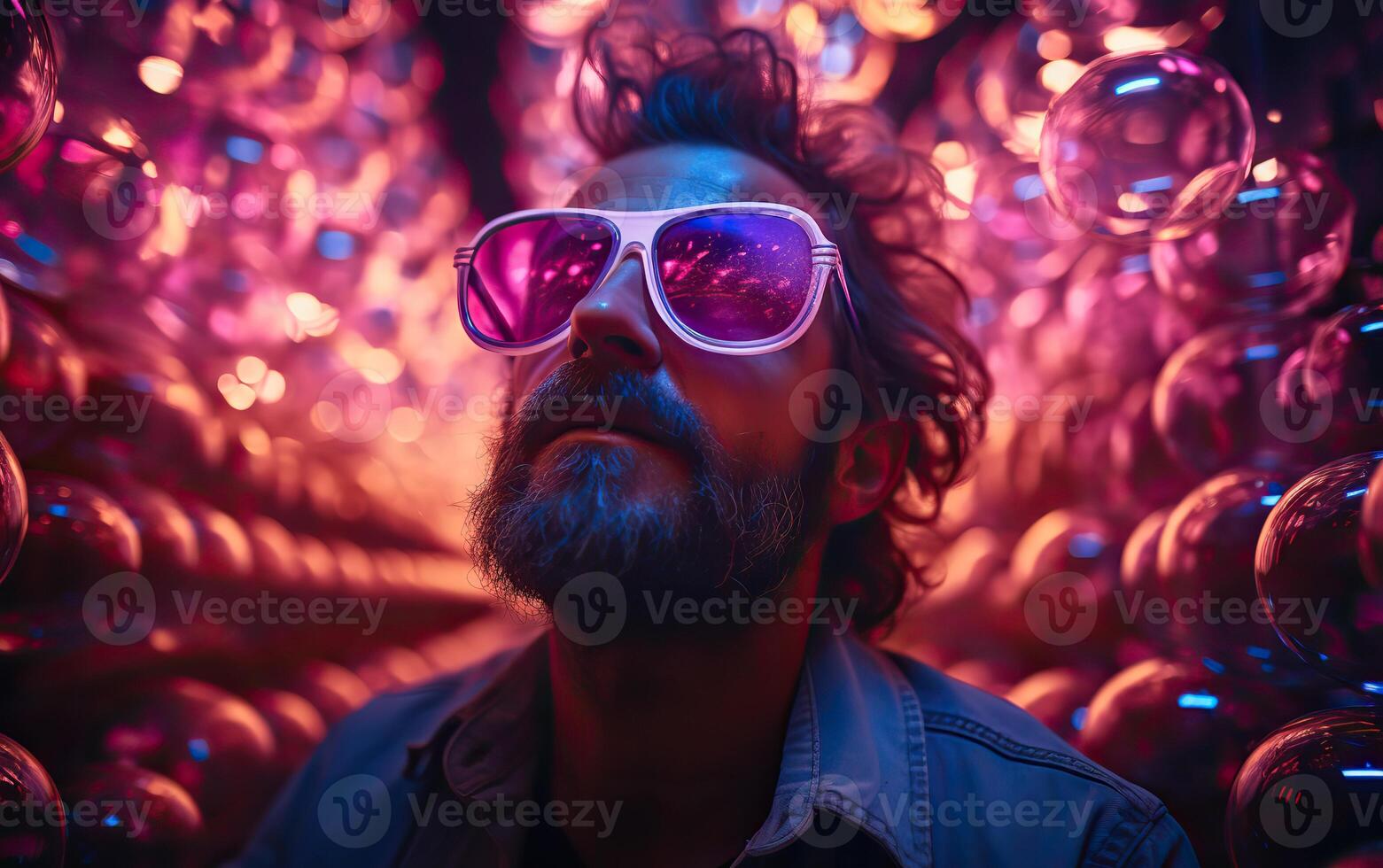 Handsome man in colorful sunglasses with smile attractive portrait in neon tunnel background scene photo