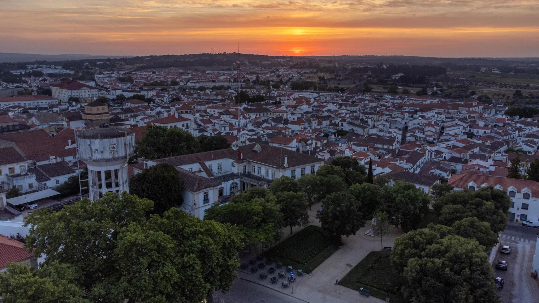 Evora, Portugal. June 4, 2024. Aerial view of Evora at sunset, showcasing its historic architecture and golden hues, capturing the enchanting ambiance of this ancient Portuguese city. photo