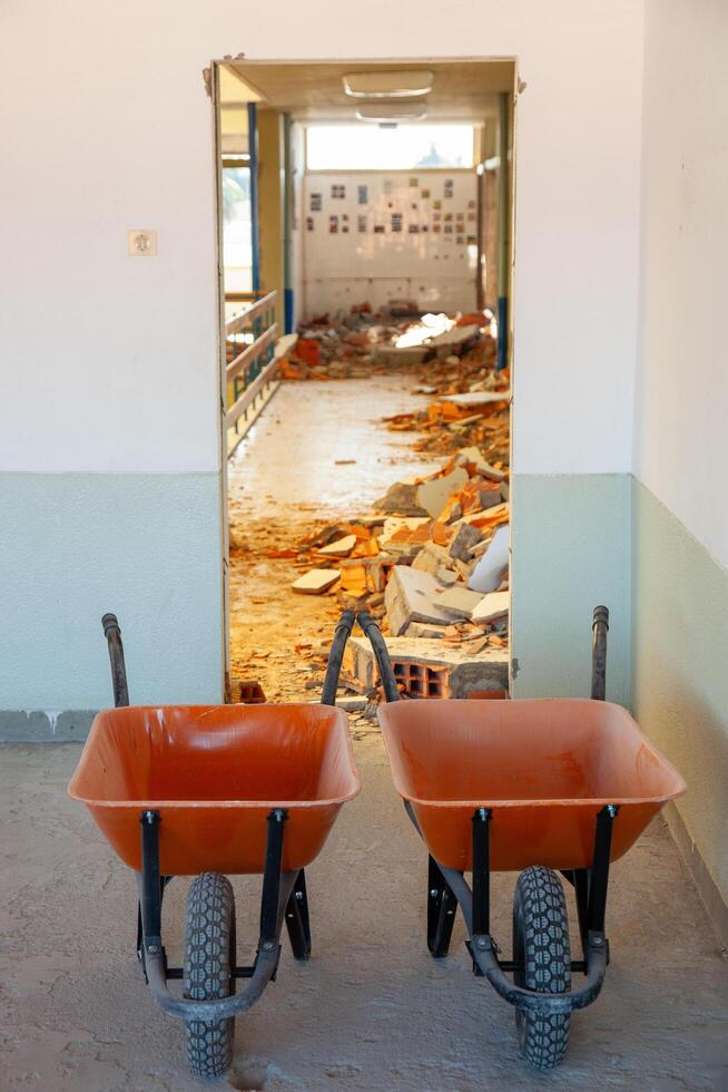 Construction site with wheelbarrows ready for work. Ideal for industrial, renovation, or building projects. photo