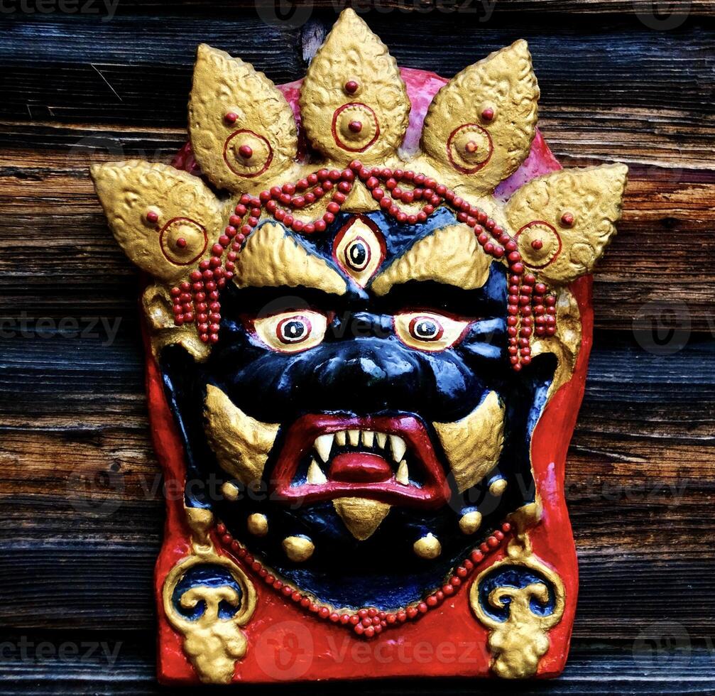 Mongolian mask of Ochirvani - the god of weather and the creation of the earth photo