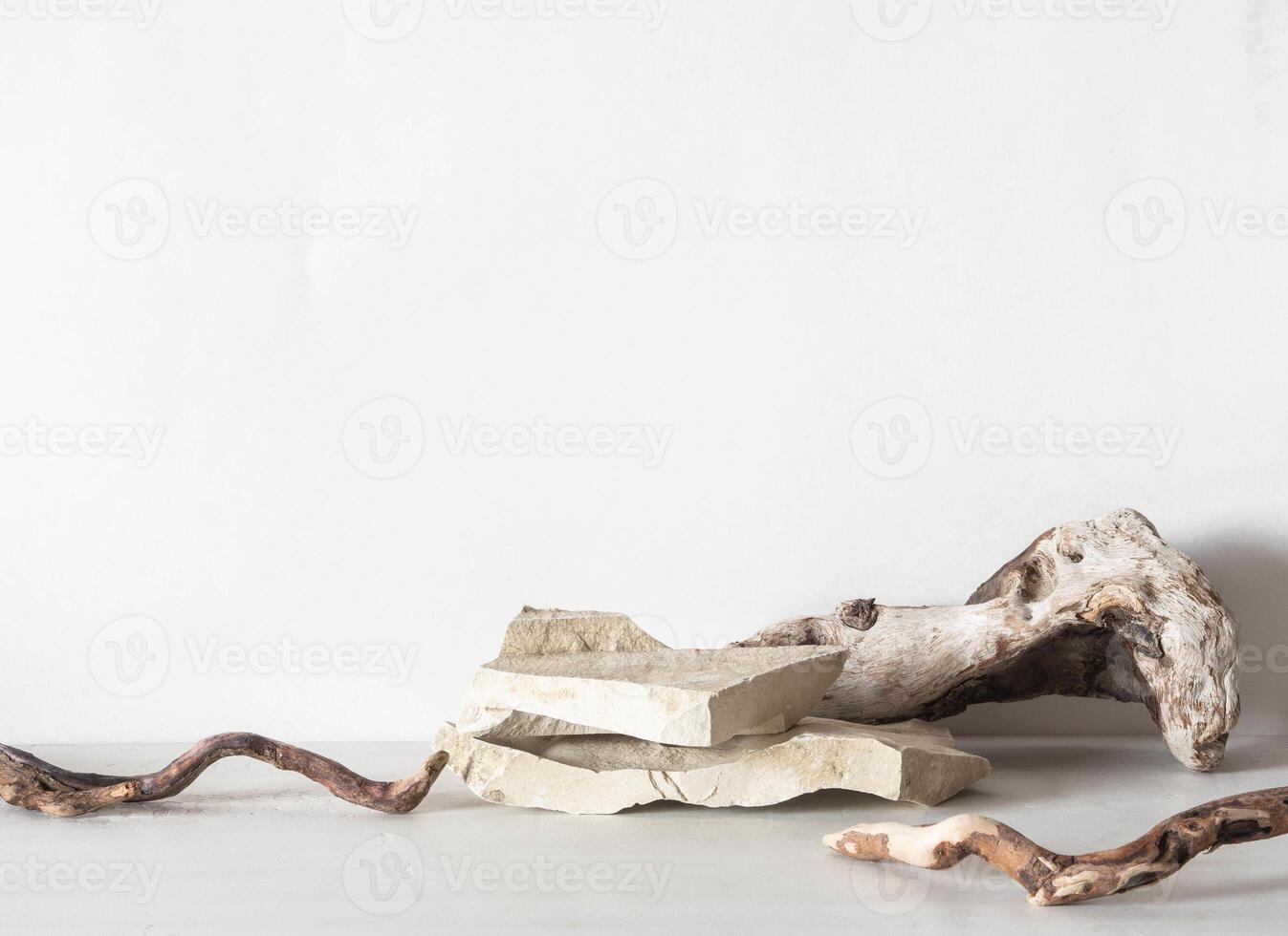 Grey natural stones podium on white background, platform for product display. photo