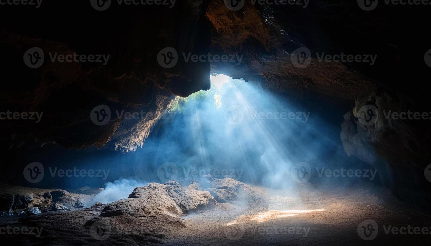 sunlight shining through a cave in thailand photo
