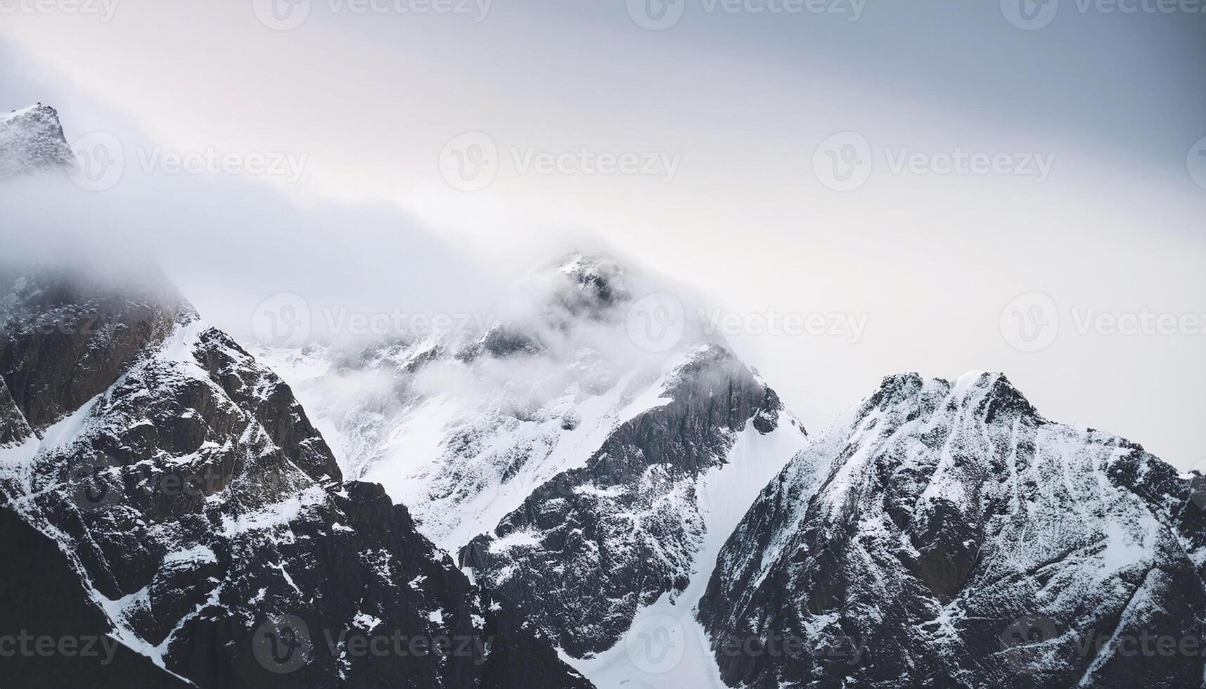 a mountain range is covered in snow photo