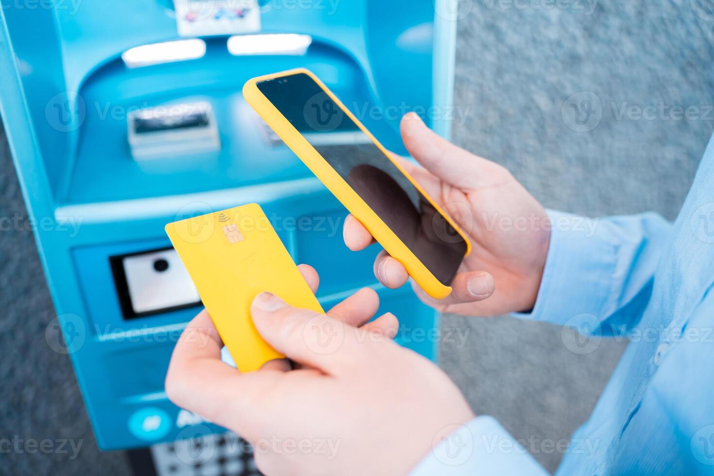 hand holding the phone with mobile wallet to pay online at the gas station photo