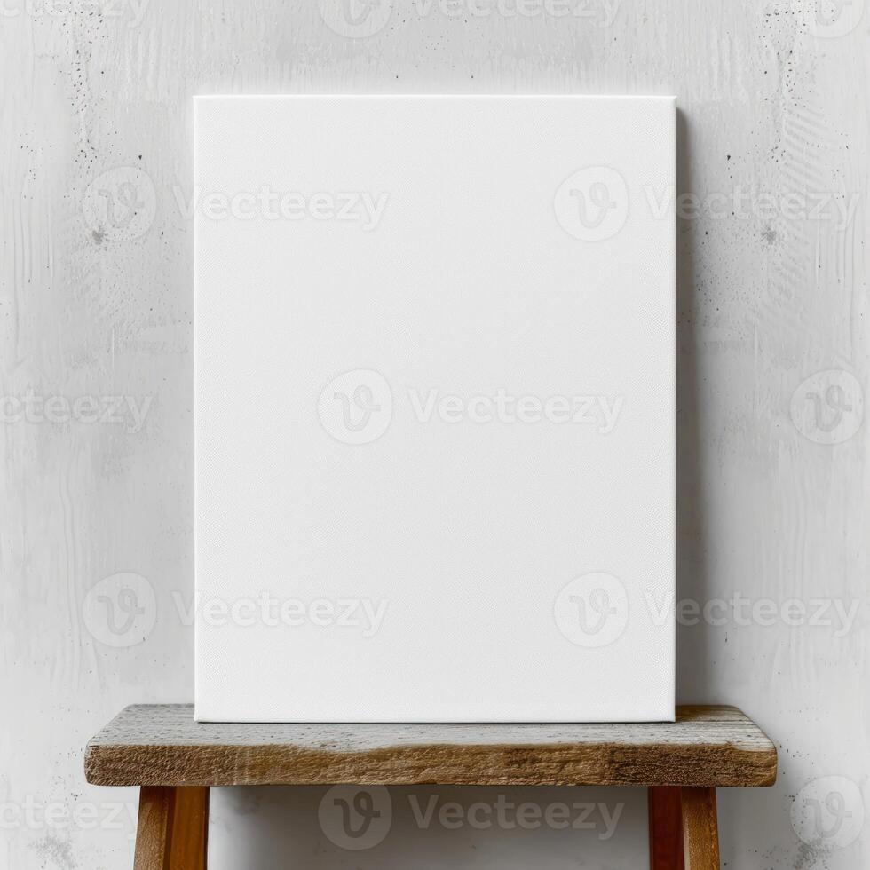 a blank canvas sitting on a wooden table, photo
