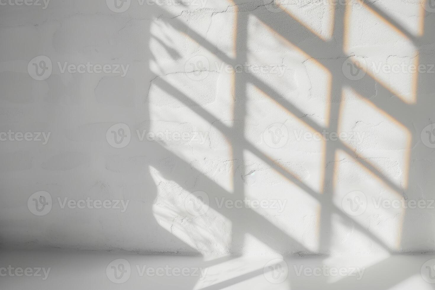 white wall and shadows on the floor in front of it, photo