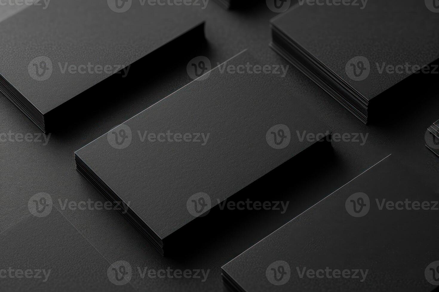 several black business cards stacked over looking at the camera, photo