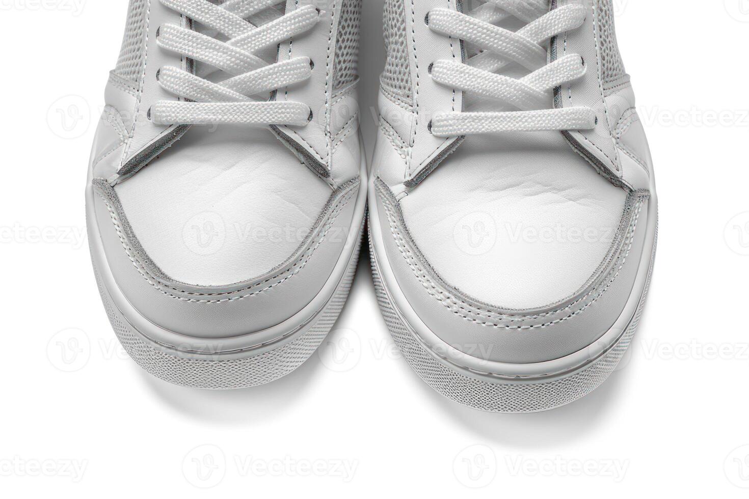 view of white sneakers with leather upper laces, photo