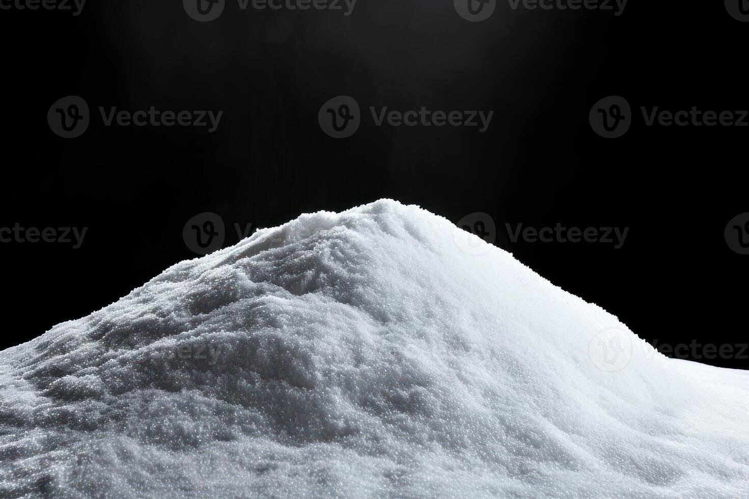 snow is piled on the side of a mountain in front of sunlight, photo