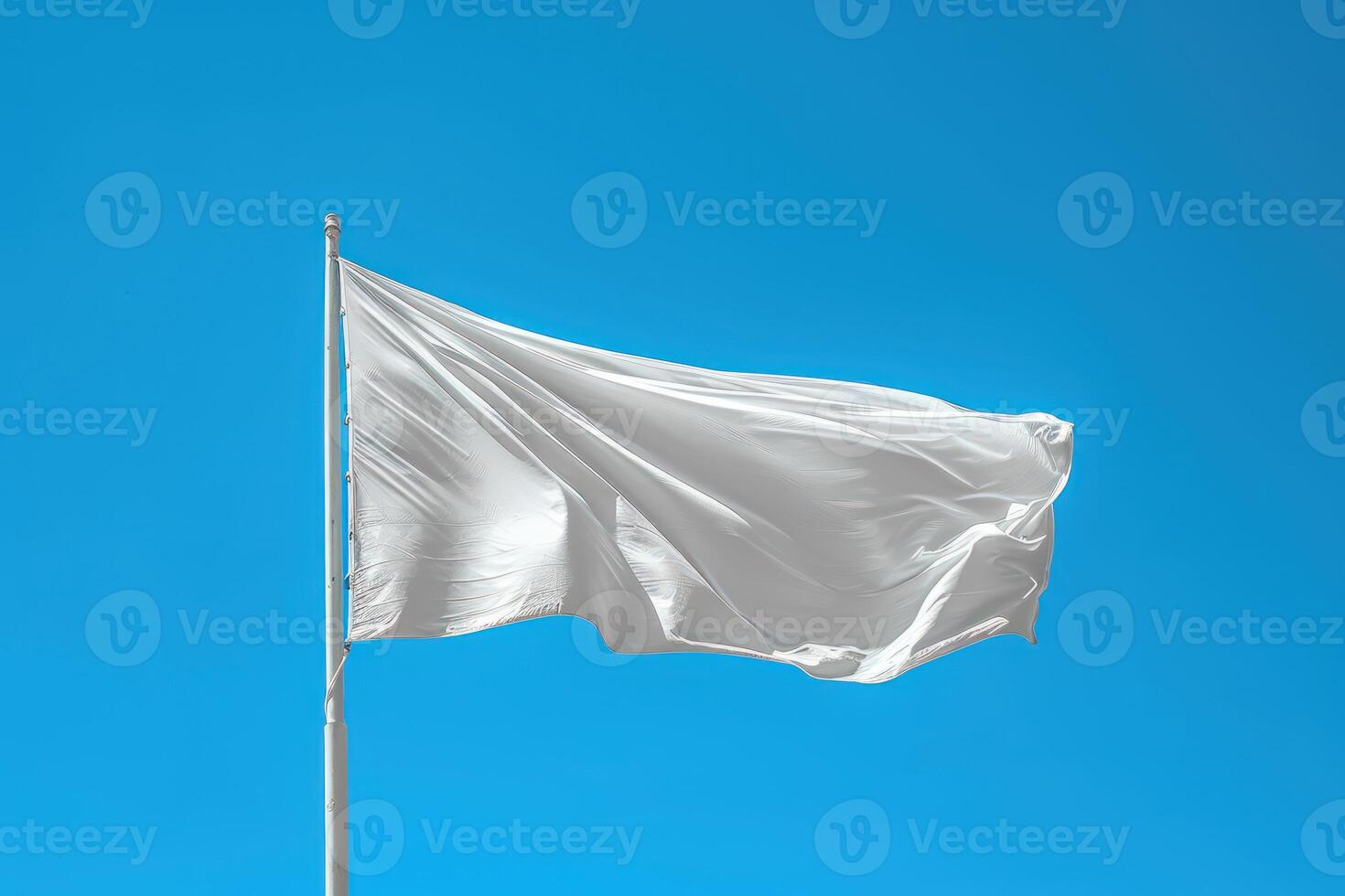 the white waving flag is in front of a blue sky, photo