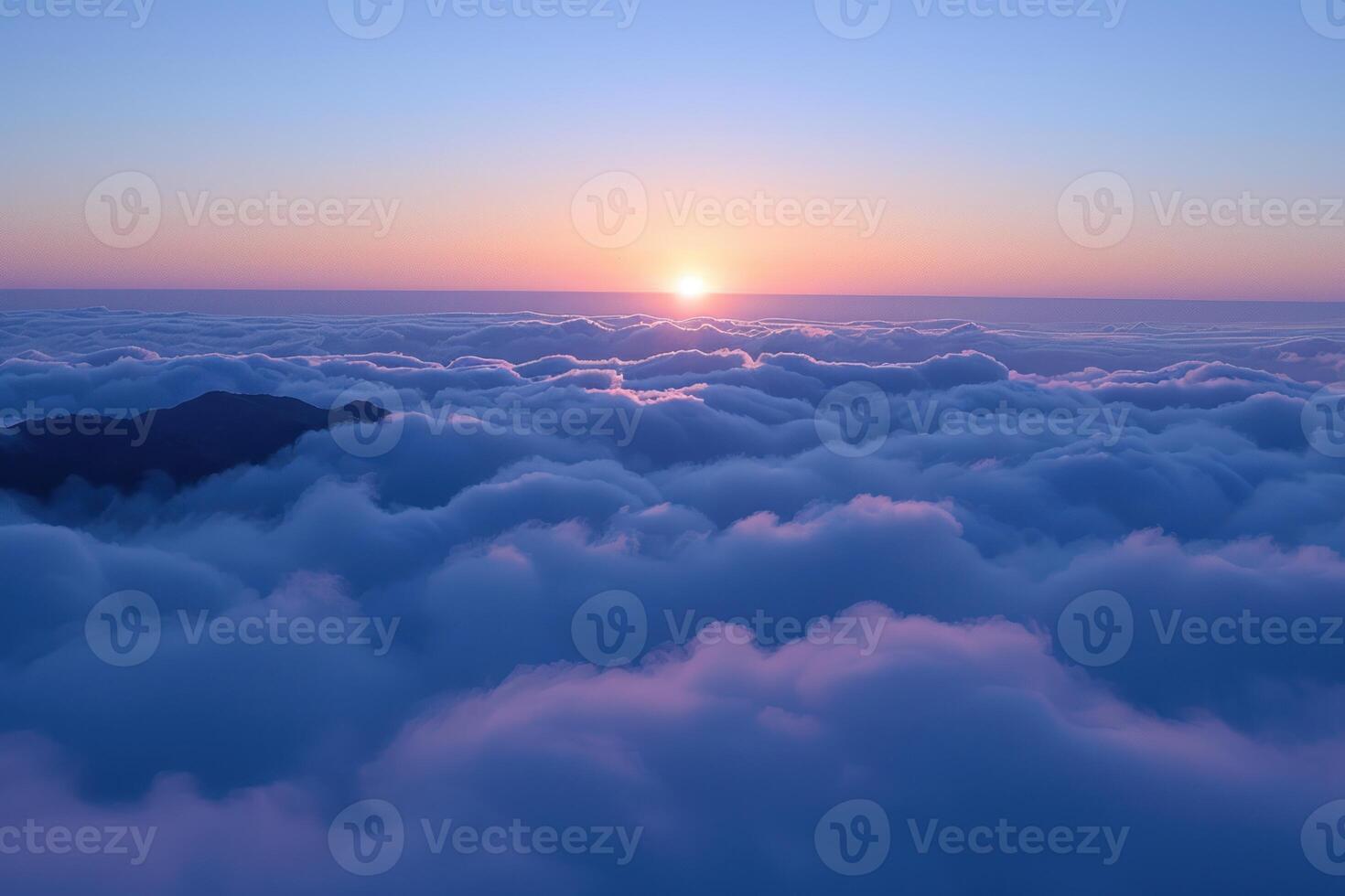 mountains above the clouds under blue sky, during sunset, photo