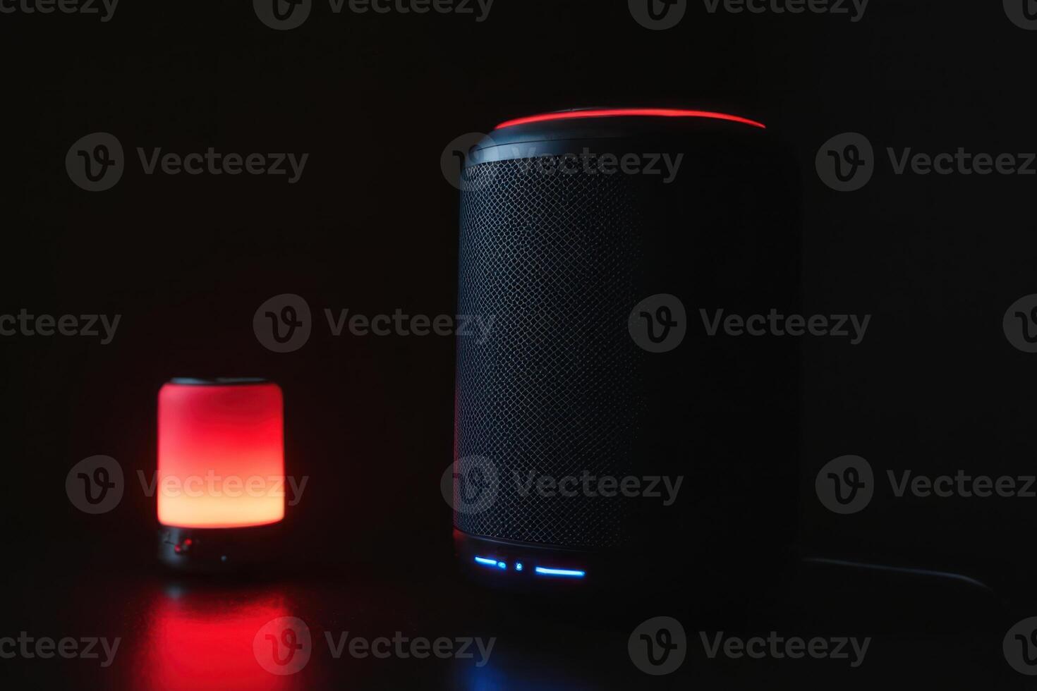a lit table has an illuminated speaker and phone, photo