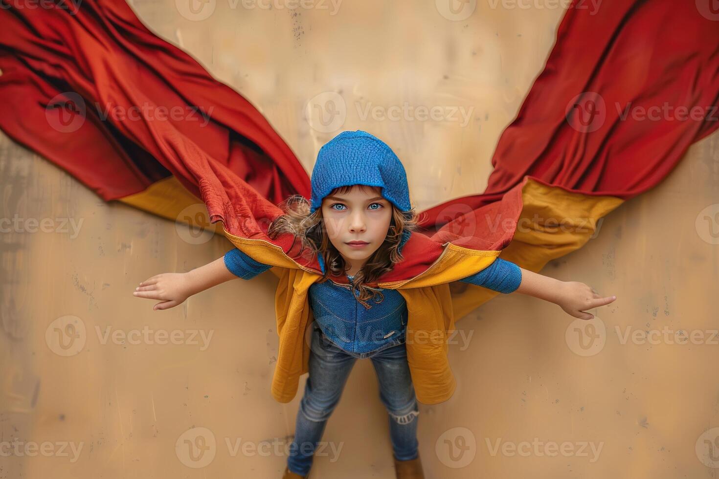 an overhead view of a pretty girl with red and yellow cape, photo