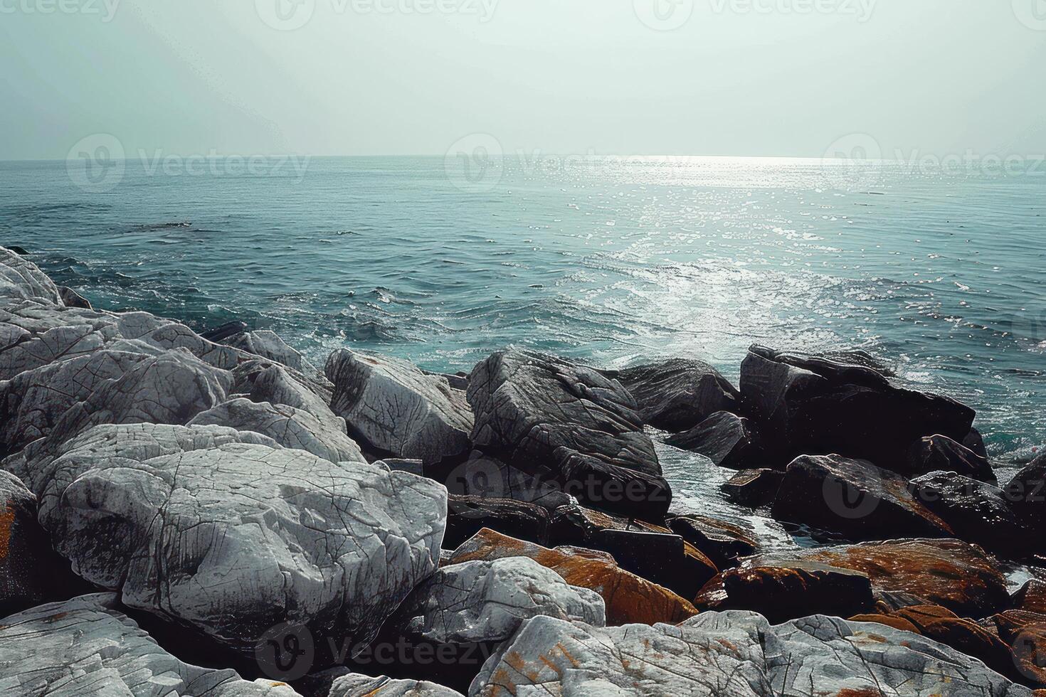 view from the side of large rocks at beach, photo