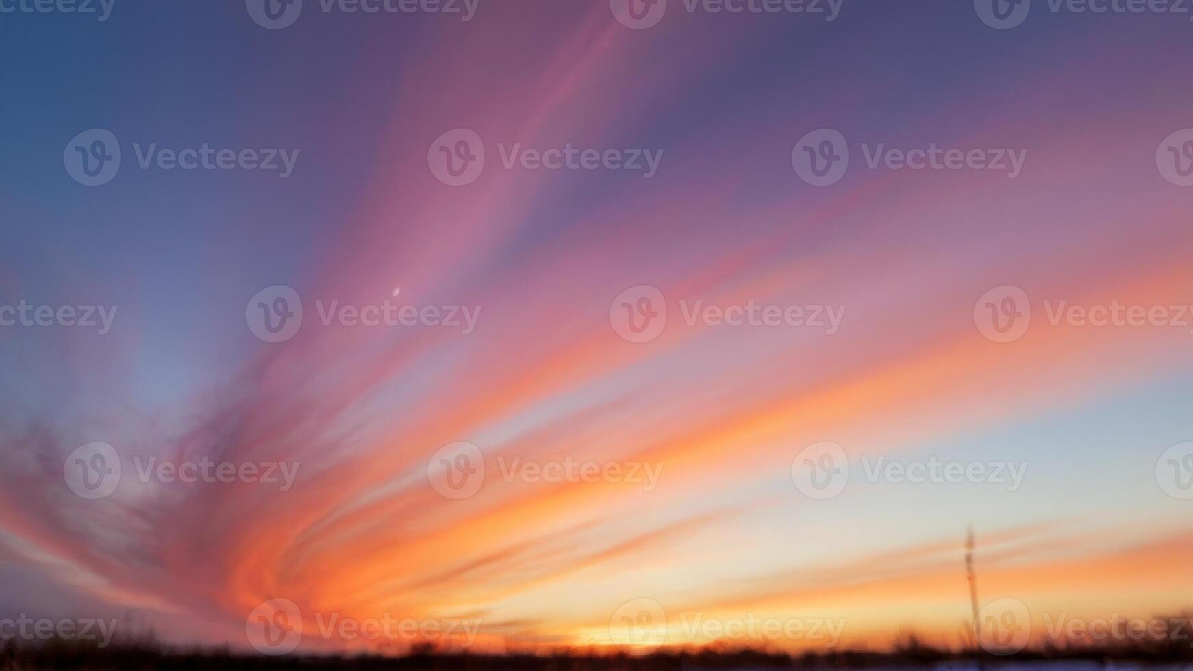 the brightly colored clouds on this sunset show, photo
