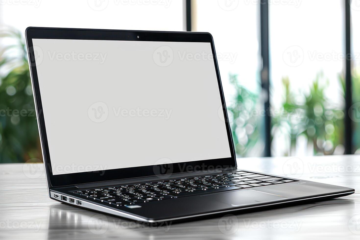 the open acent laptop is sitting on the table, photo