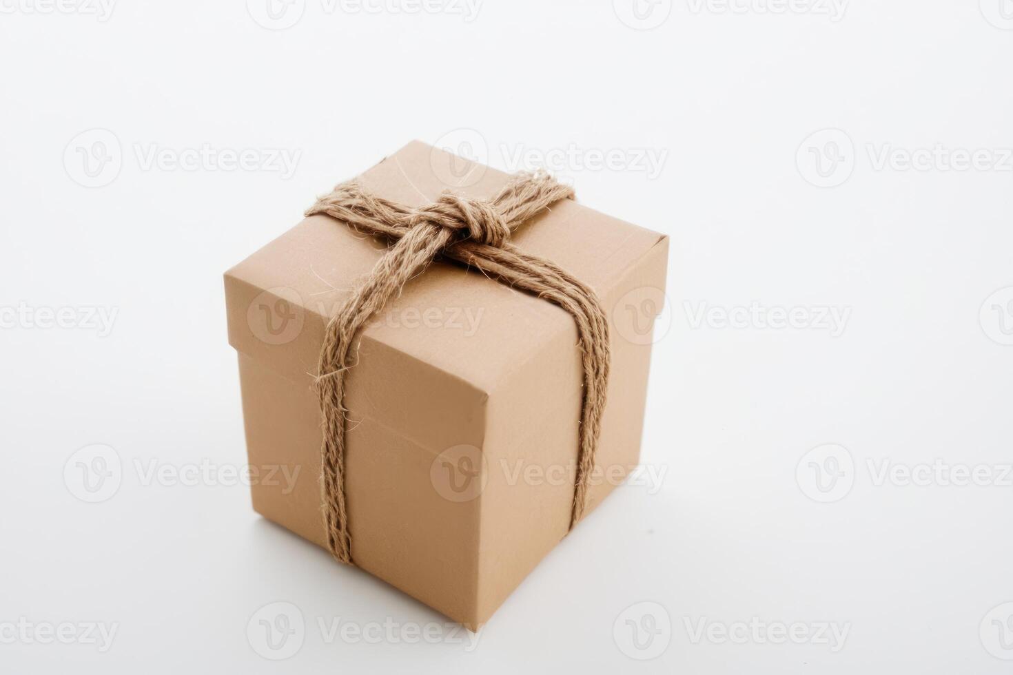 a brown box tied up with a string, photo