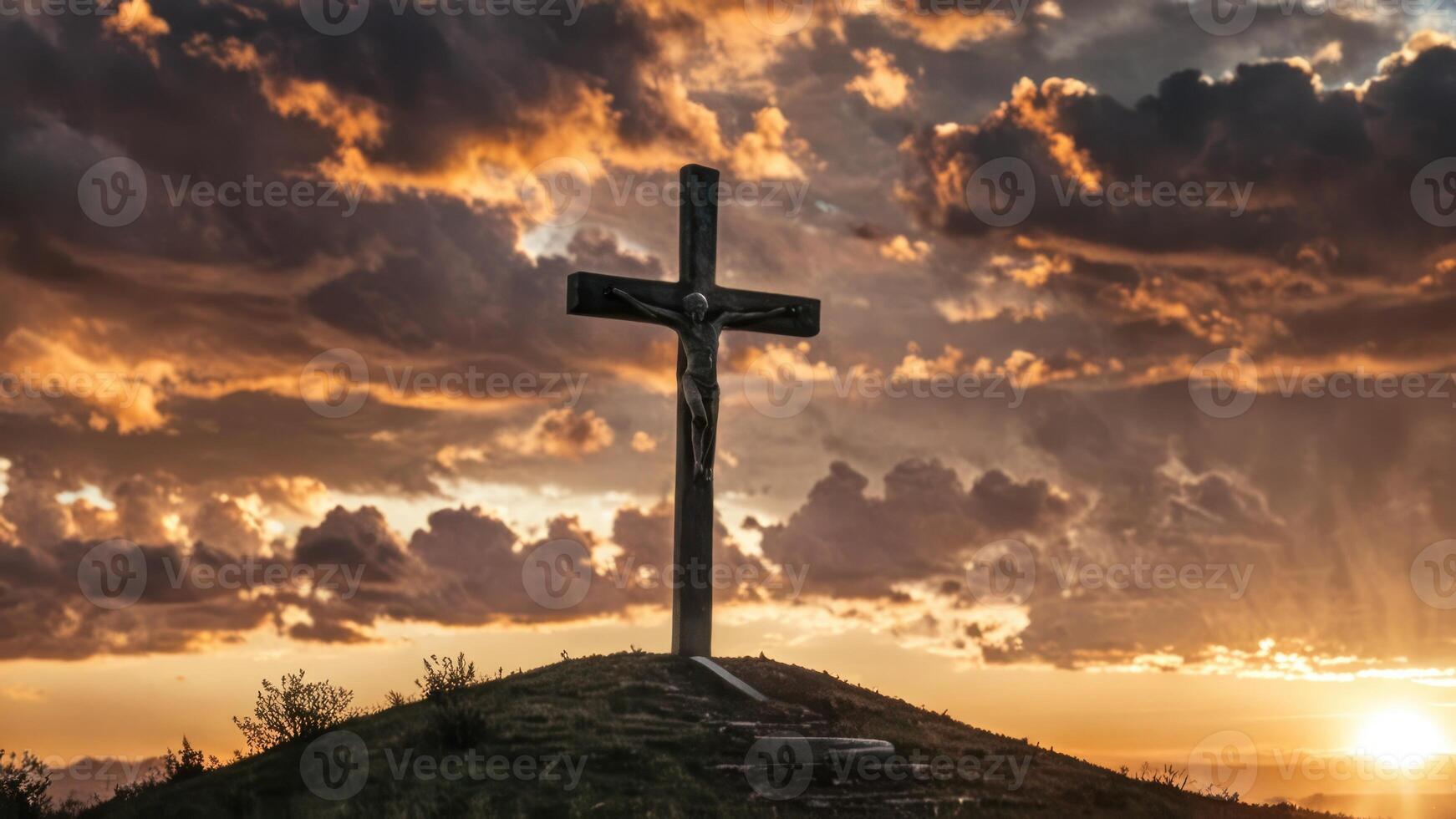 a stone cross sits atop an mound at sunset, photo