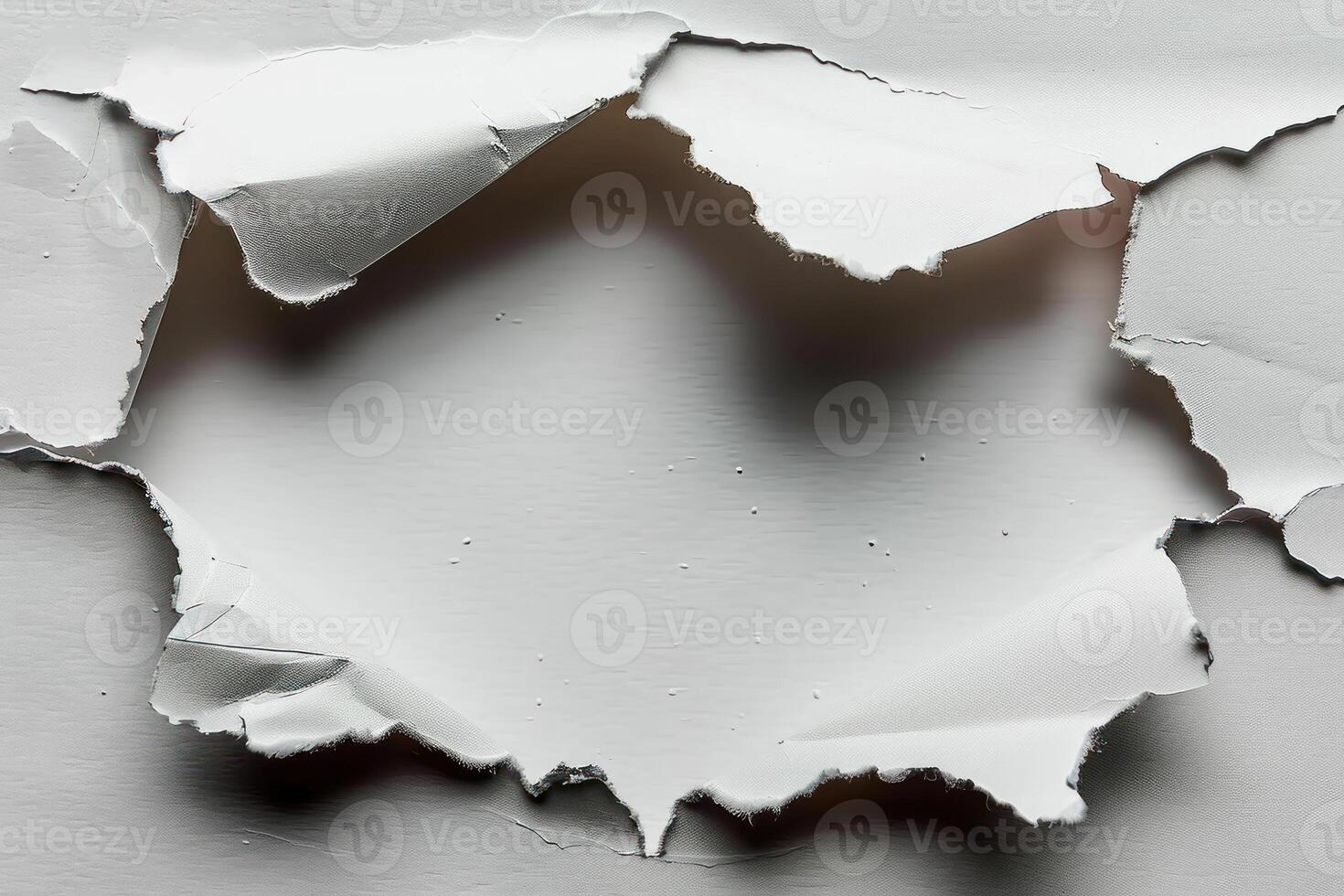 torn pieces of peeling white paper sitting on top of a wall, photo