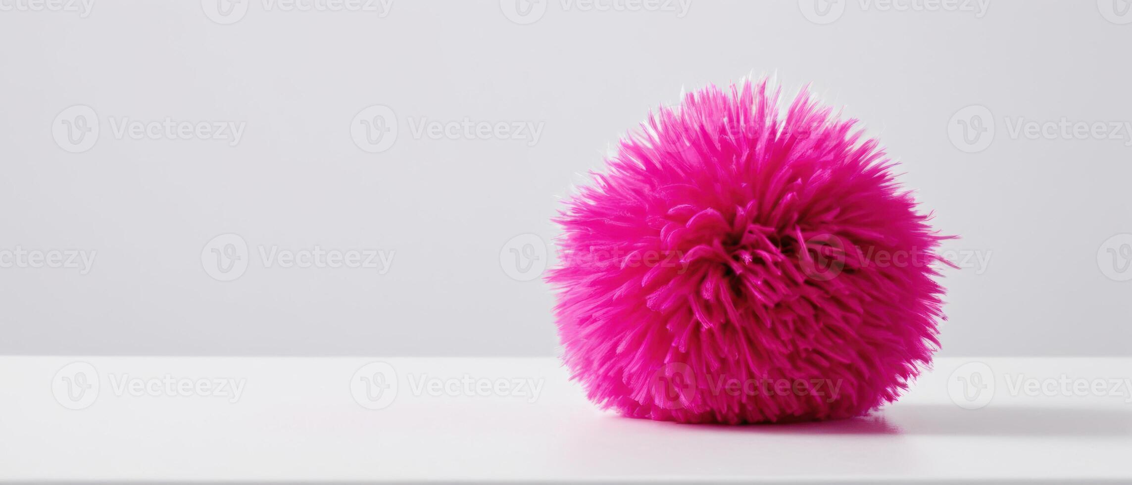 large pink vase with some green in it, photo