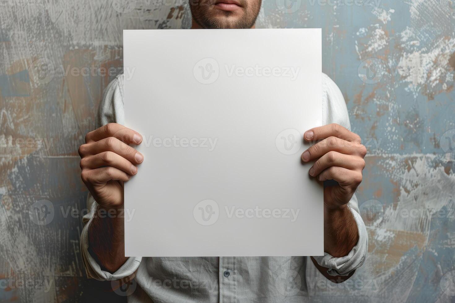 a man in sunglasses holding up an empty piece of paper, photo