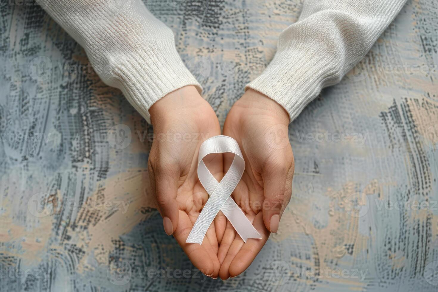 a person with a white ribbon in their hands, photo