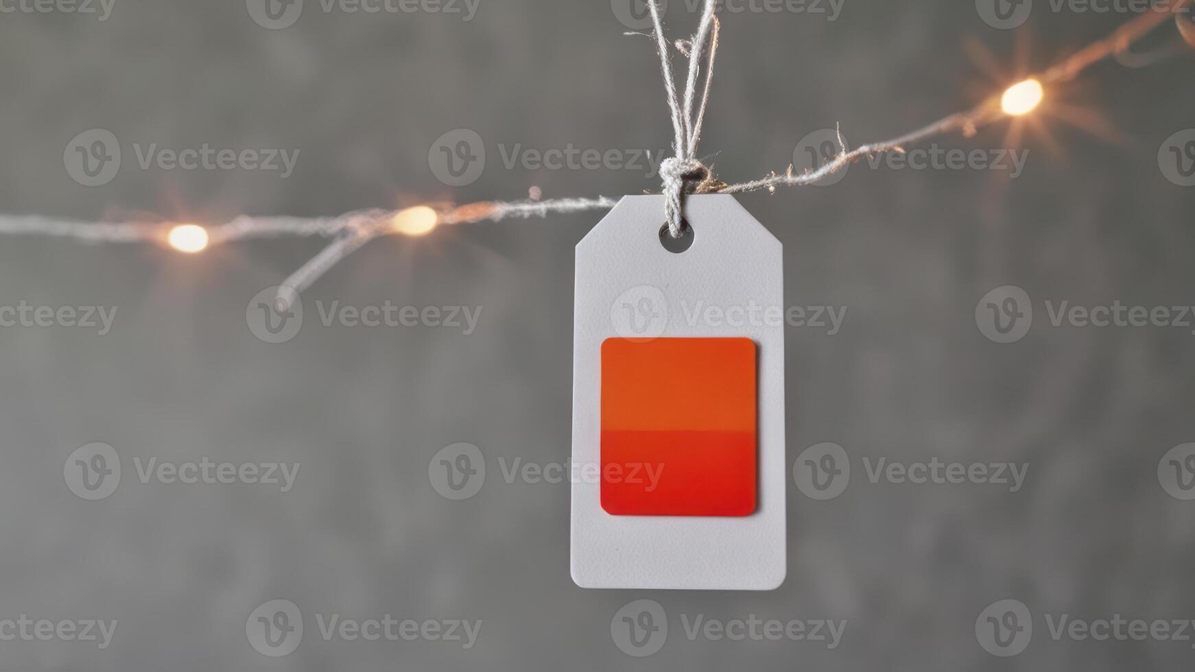 an orange square has been placed between string lights, photo