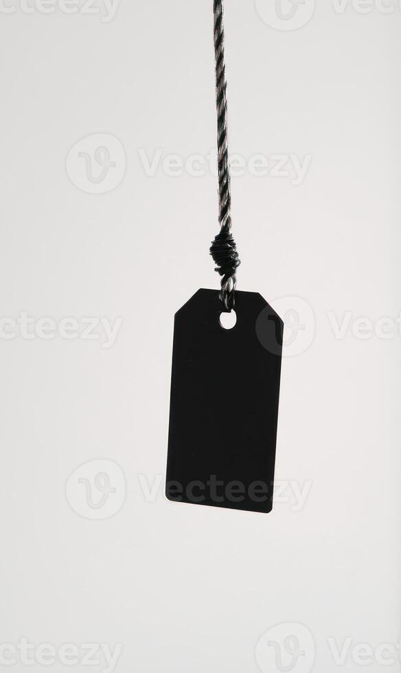 tag hangs on string in the air, with clip, photo