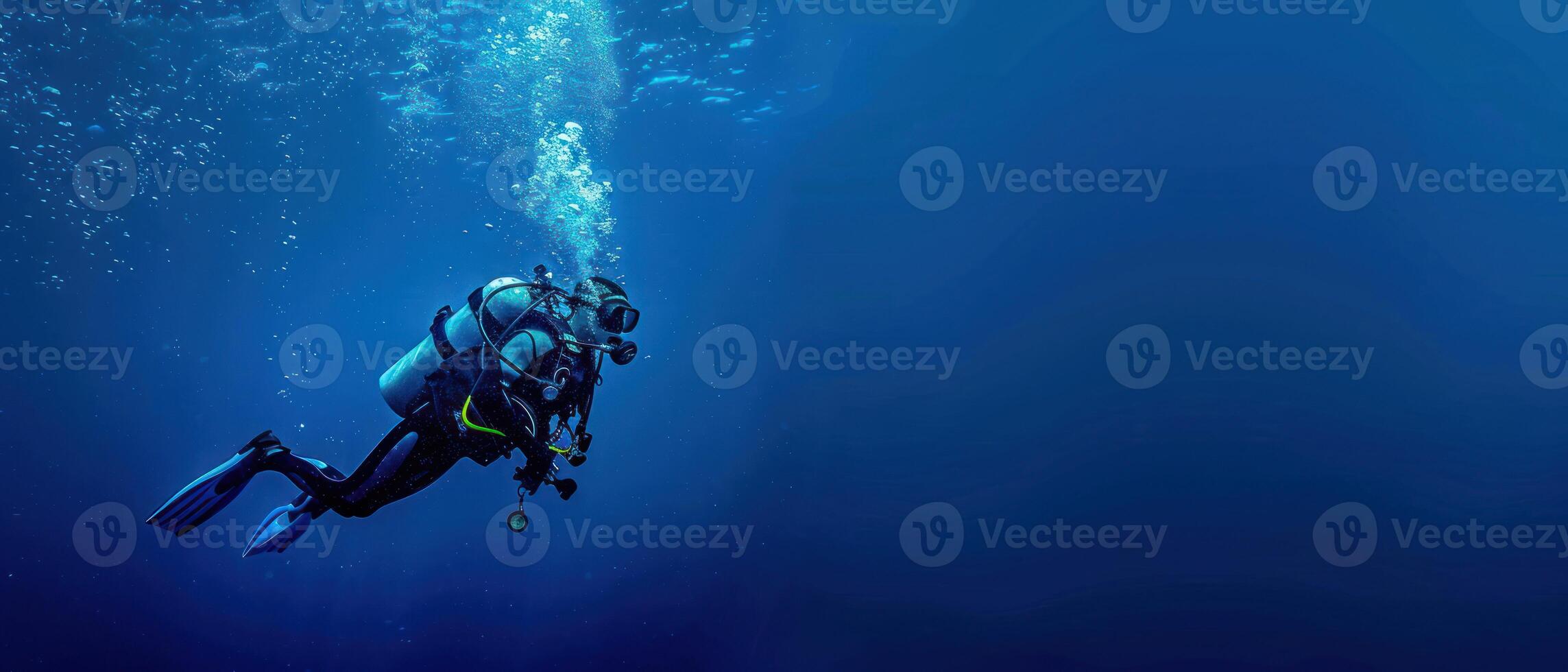 man on diving gear in very deep ocean waters, photo
