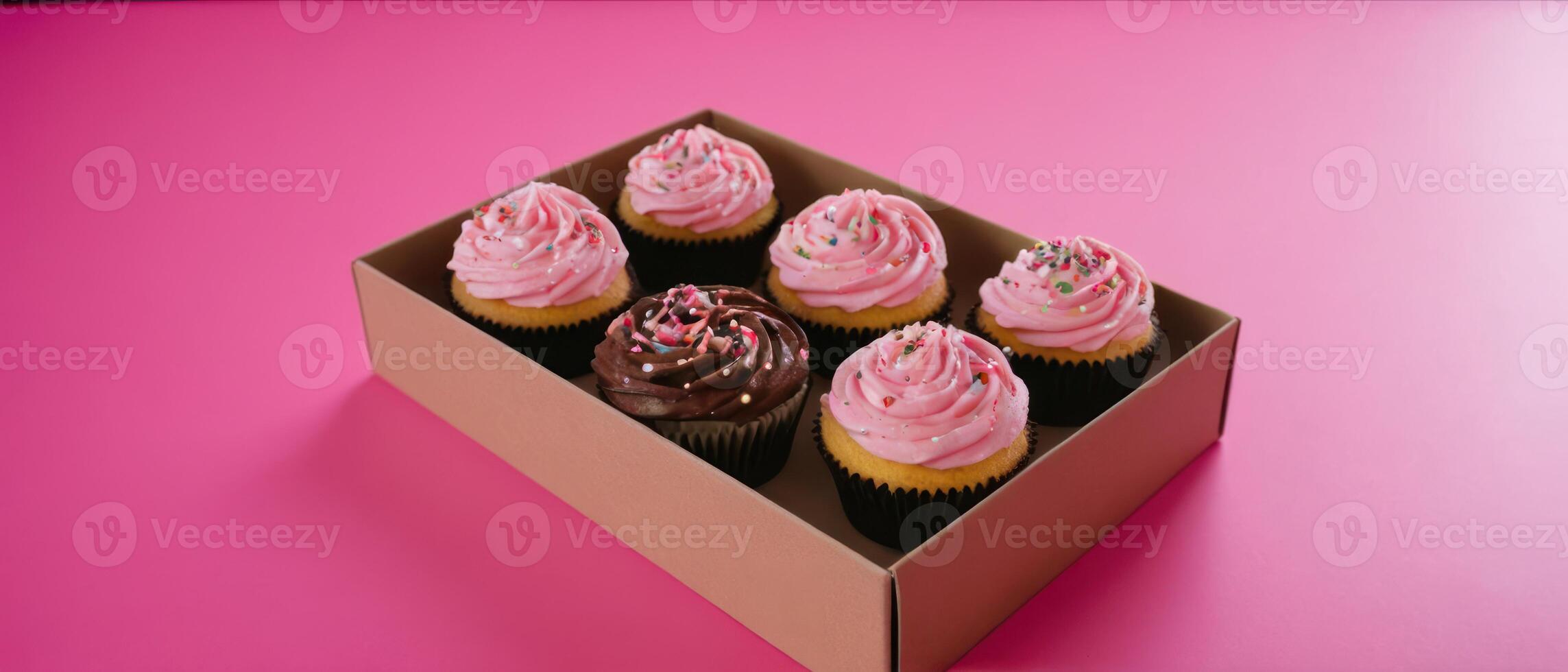 four dozen cupcakes in box on pink table, photo