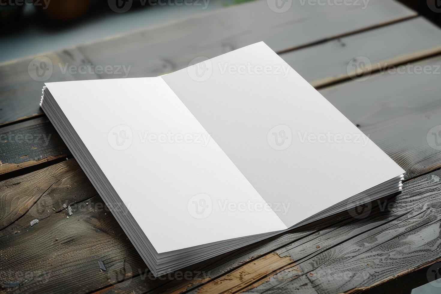 an open book sitting on top of a wooden table, photo